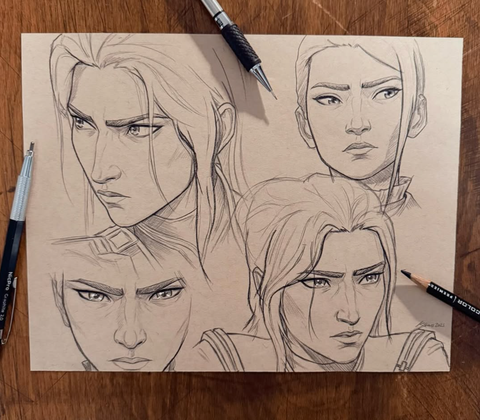Five pencil studies of a character’s face and expression on toned paper.